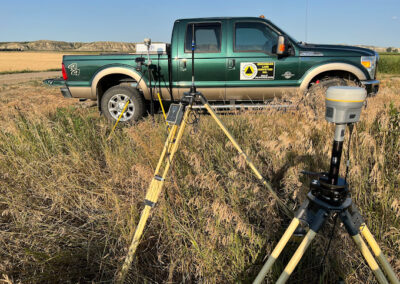 benchmark land surveyors truck in the field